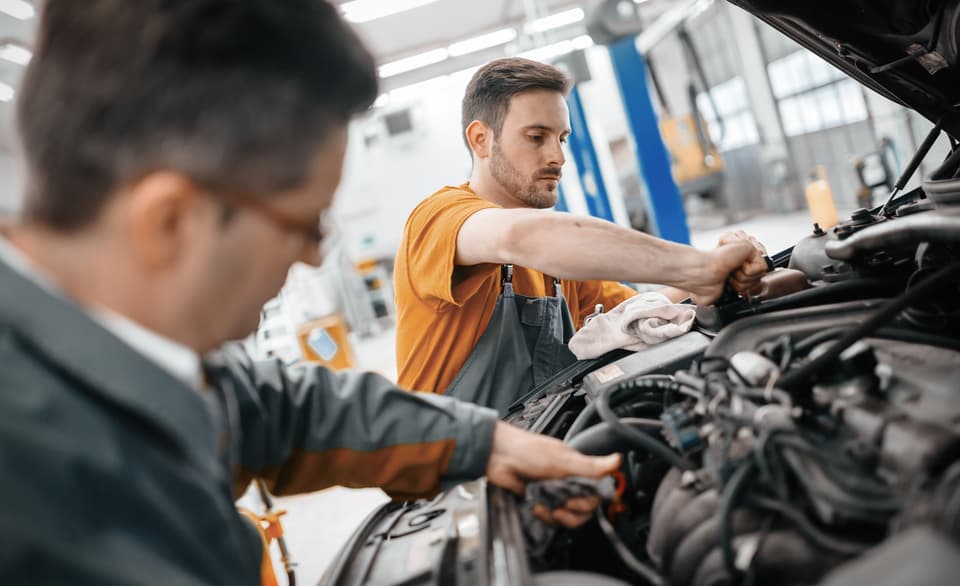 Mechanic working on a car in the workshop